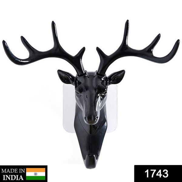 Decorative deer head hook with adhesive backing for doors